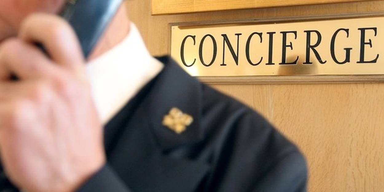 Professional concierge at reception desk